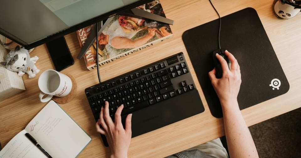 Working at computer | photo by Maria Roberts